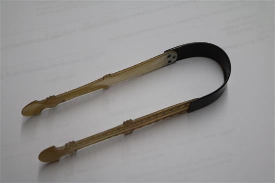 A pair of George III mother of pearl and tortoiseshell sugar tongs